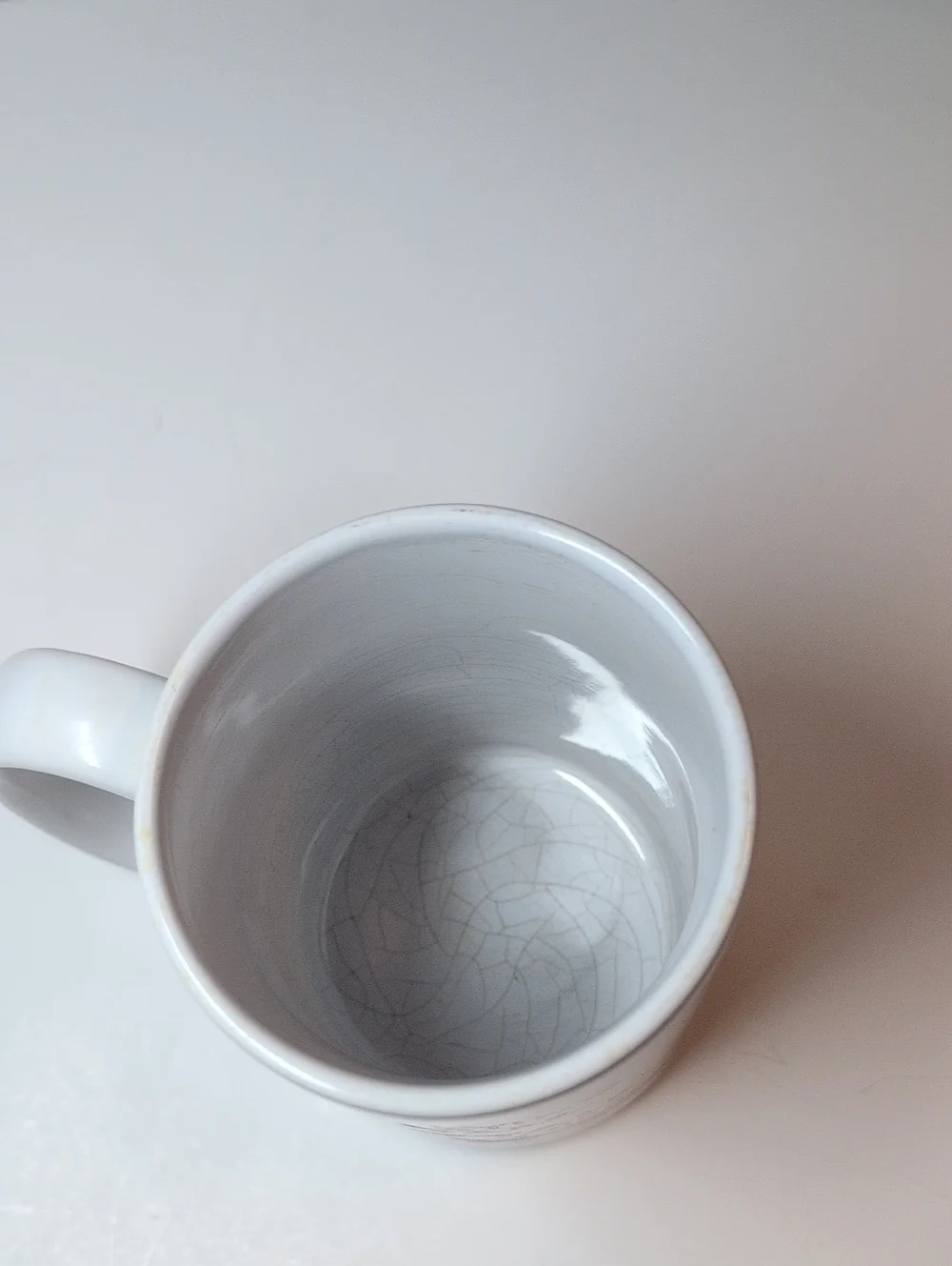 Roger's Tattle Tale White Ceramic Mug with Red Logo
